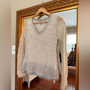 Beautiful Knitted and Knotted Anthropologie sweater in pale grey